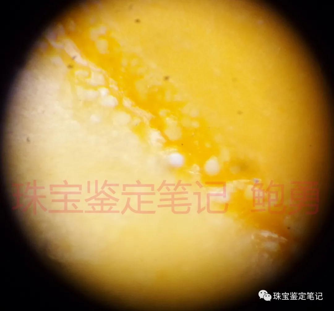 一則壓制斜頑輝石仿緬甸黃玉的檢測案例