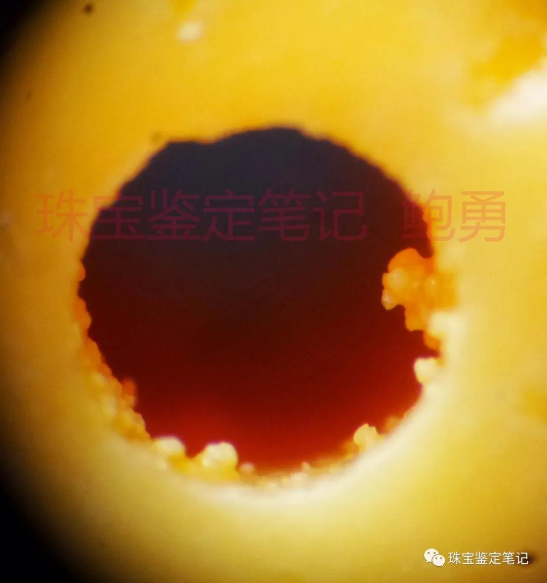 一則壓制斜頑輝石仿緬甸黃玉的檢測案例